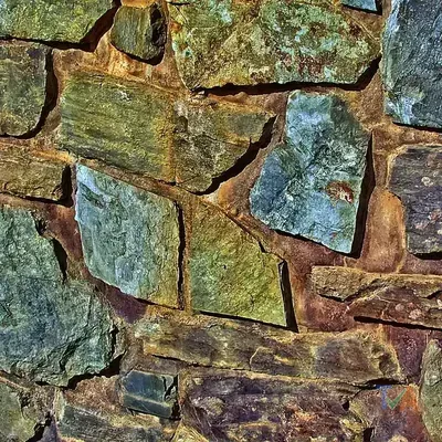 Retaining wall builder constructing stone garden wall — Australia