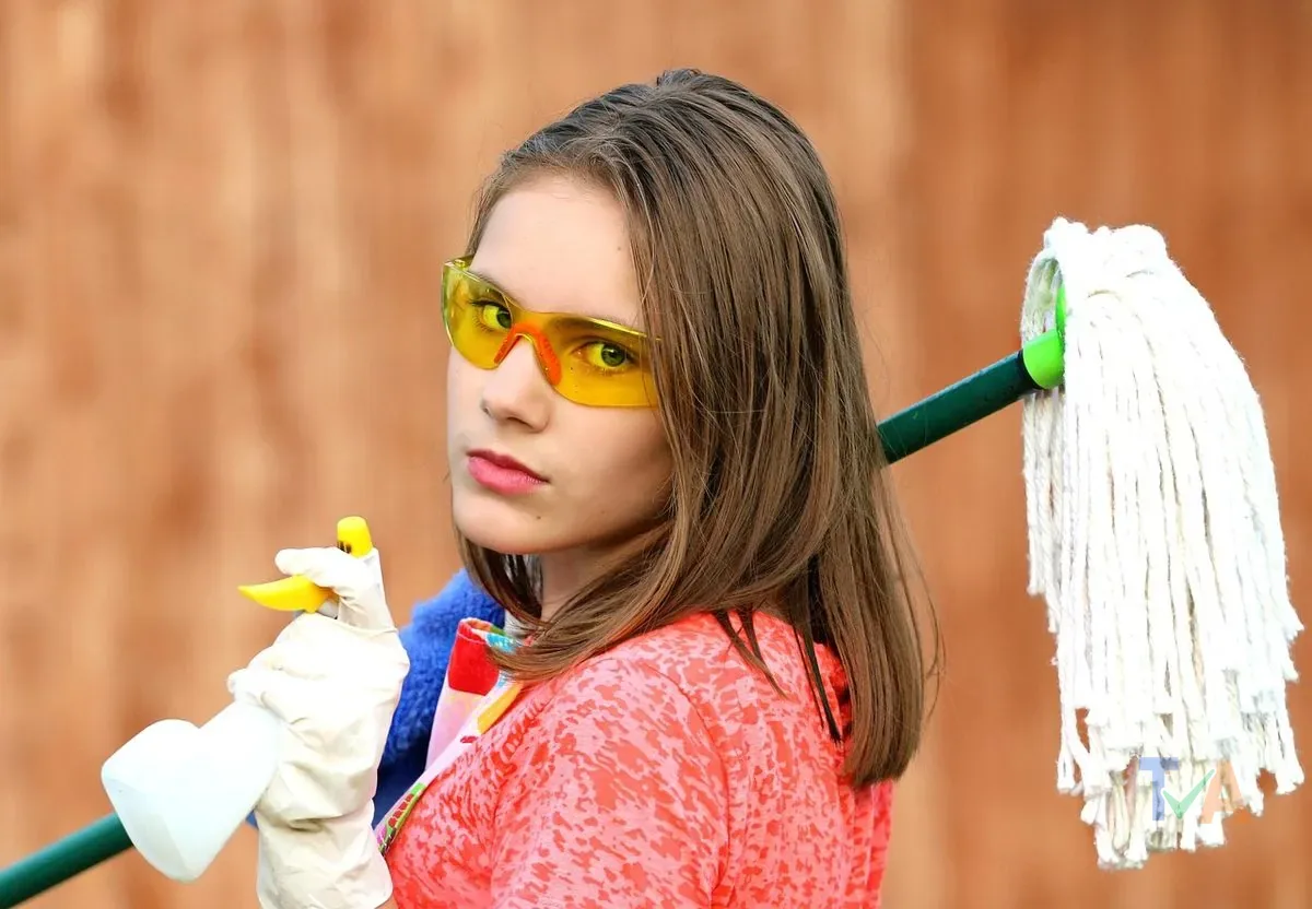 Professional cleaner mopping apartment floor for end of lease bond clean