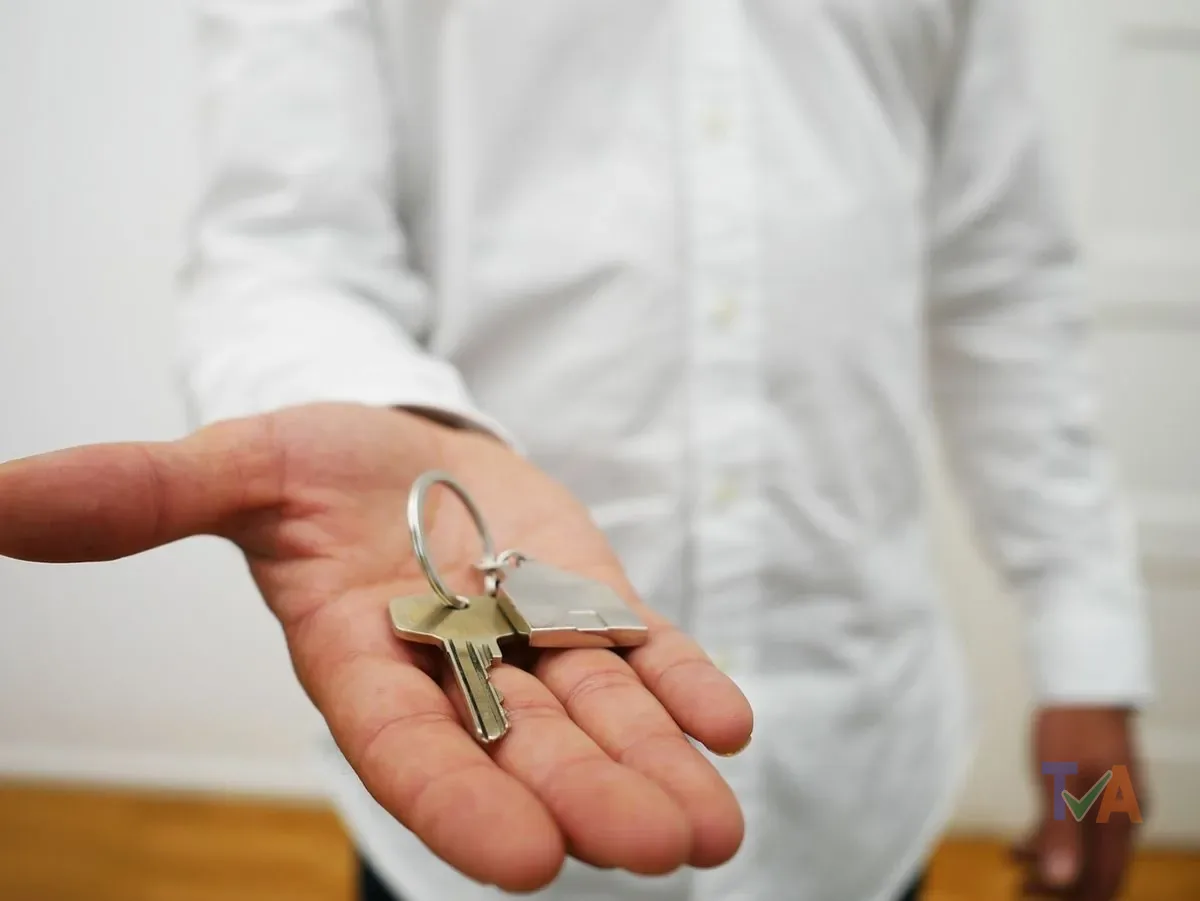 Locksmith cutting duplicate keys at a professional workshop