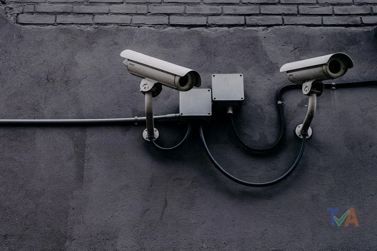 Home security camera and alarm system installed on house exterior
